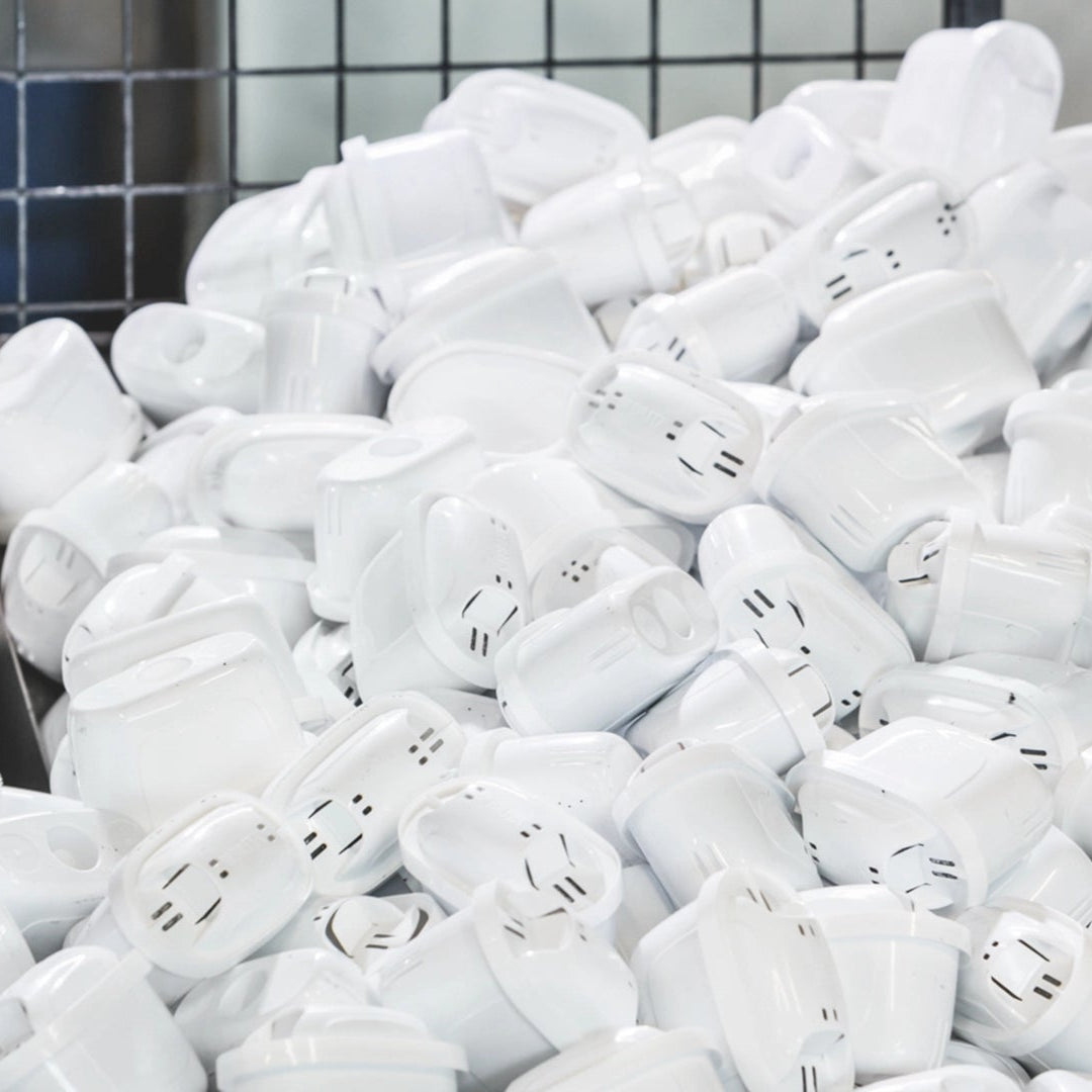Pile of used MAXTRA PRO water filter catrtridges ready for recycling.