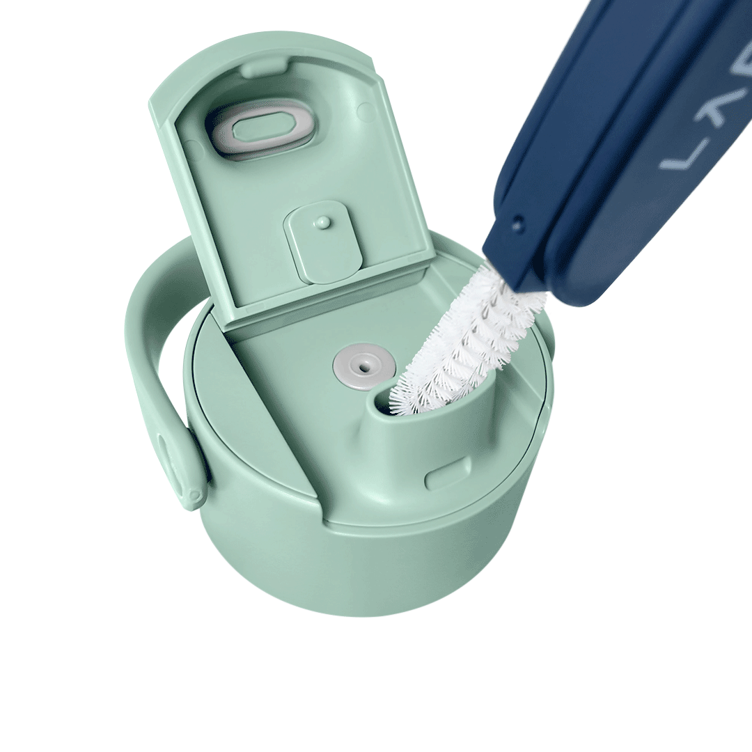 Close-up of a BRITA LARQ Bottle lid being cleaned with a BRITA LARQ Cleaning Brush