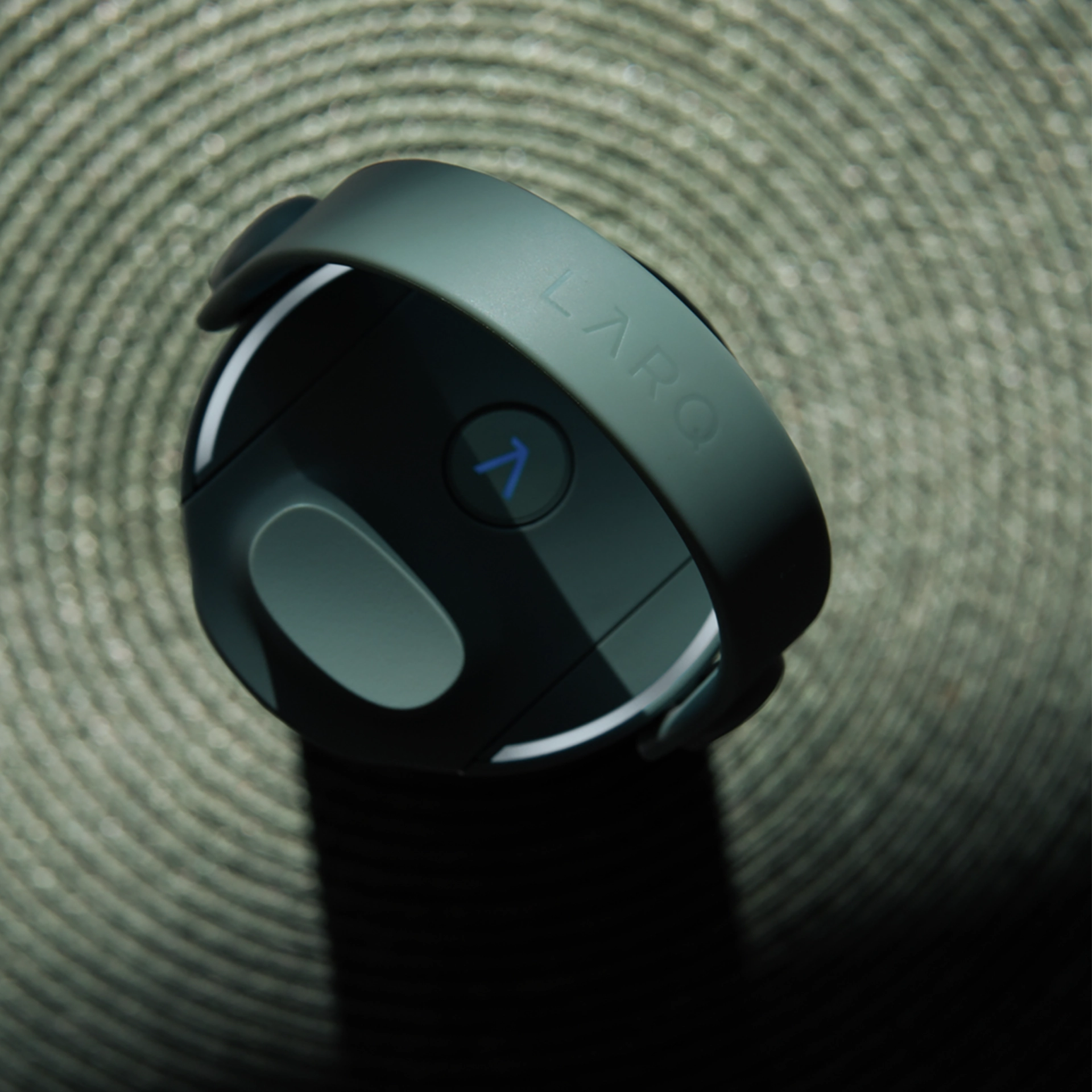Detail of a LARQ bottle cap featuring the built-in activation button